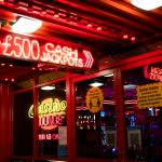 red and white coca cola neon signage