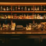 brown wooden shelf with bottles